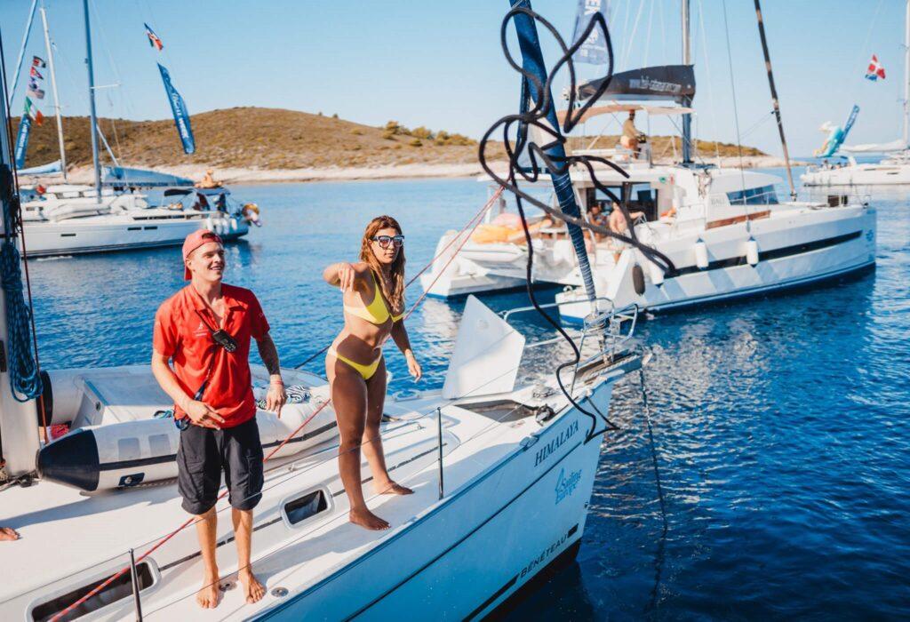 Guests on the deck of the Himalaya yacht during a supported sailing flotilla in Greece
