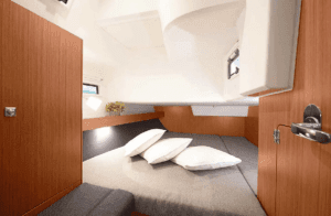 Spacious double cabin interior on a luxury sailing yacht charter.