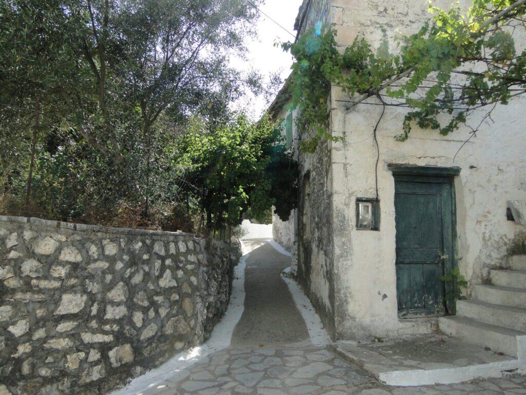 Traditional stone street in Kalamos village - Authentic Ionian island yacht charters 2026