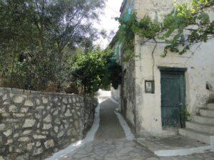 Traditional stone street in Kalamos village - Authentic Ionian island yacht charters 2026