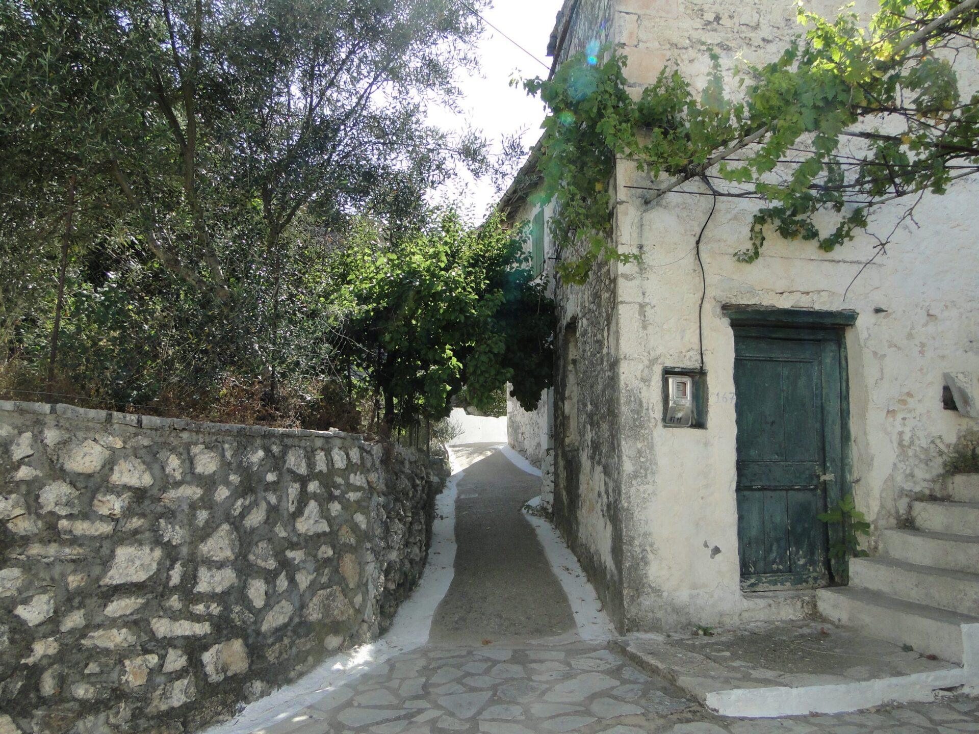 Traditional stone street in Kalamos village - Authentic Ionian island yacht charters 2026