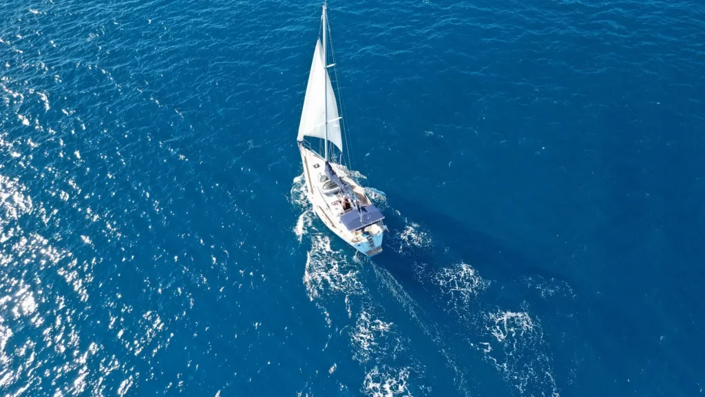 Aerial view of a luxury monohull yacht sailing in skippered charter in the Ionian Sea, Greece 2026