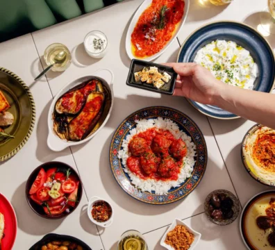 A table spread of fresh Mediterranean dishes served on the deck of a sailing yacht