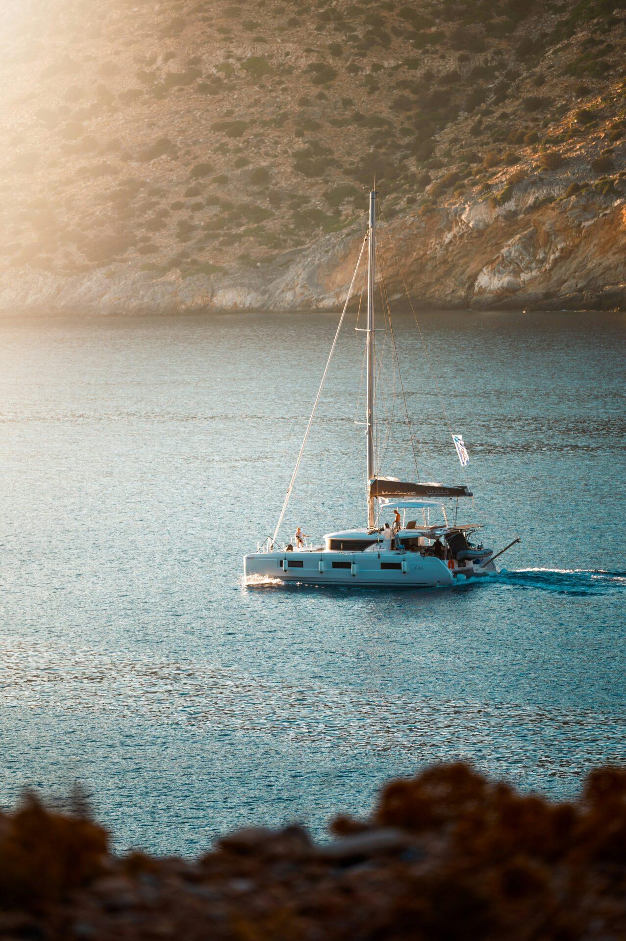 Sailing catamaran at sunset for bareboat charter Greece 2026 fleet