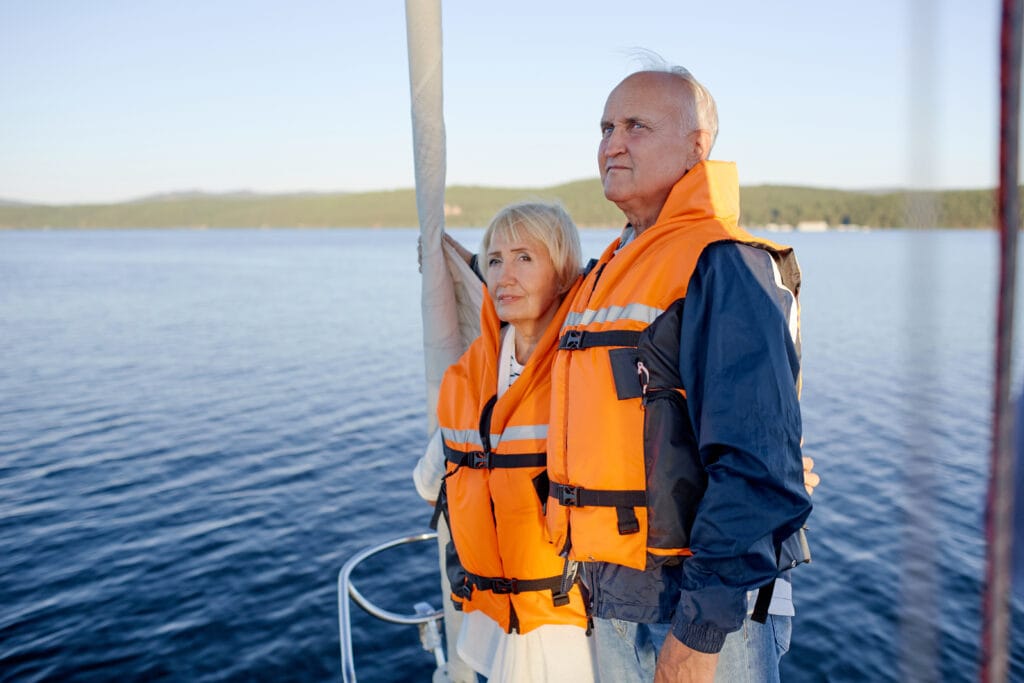 Guests wearing life jackets on a bareboat yacht charter in Greece for safety