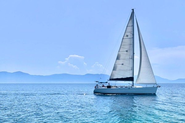 Luxury sailing yacht under full sail - Greek island hopping tours 2026