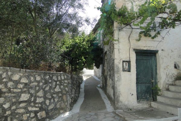 Traditional stone street in Kalamos village - Authentic Ionian island yacht charters 2026