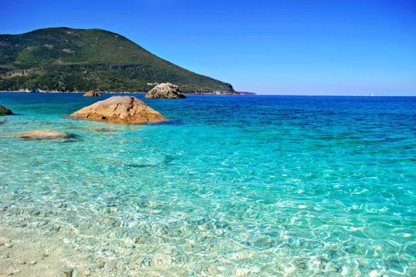 Crystal clear turquoise waters of Afales Bay in Ithaca - Ionian Island sailing 2026