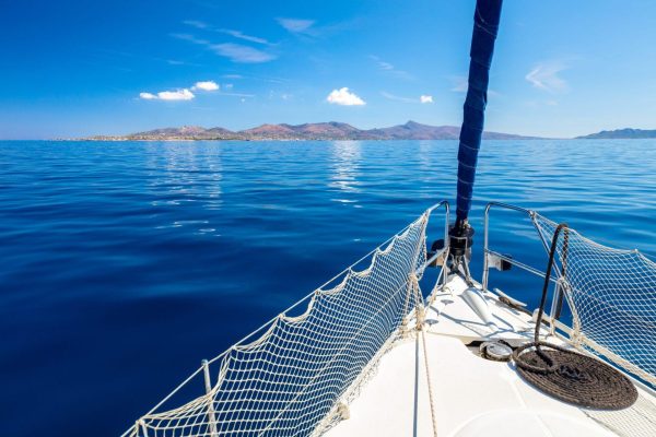Luxury sailing yacht bow view on open blue sea - Greek island hopping 2026